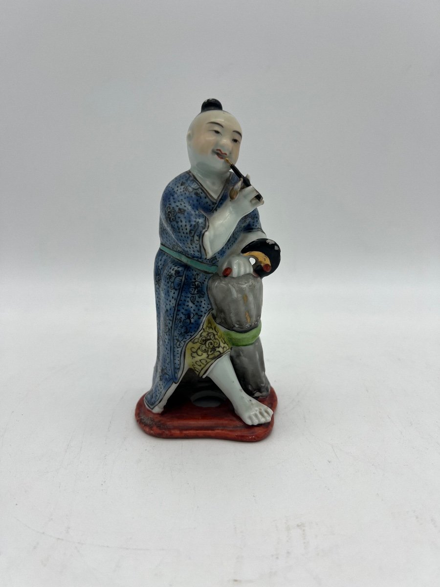 Small Polychrome Porcelain Statue. 