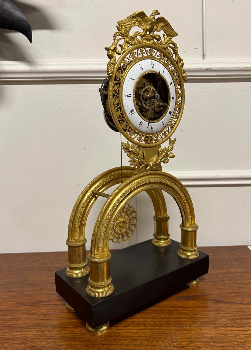 Directoire Period Arch Skeleton Clock In Gilt Bronze - Empire