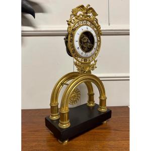 Directoire Period Arch Skeleton Clock In Gilt Bronze - Empire