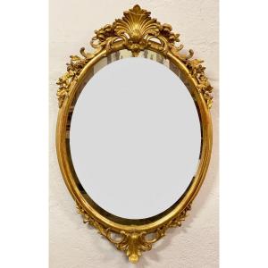 Oval Mirror In Gold Leaf. Lombardy 19th Century