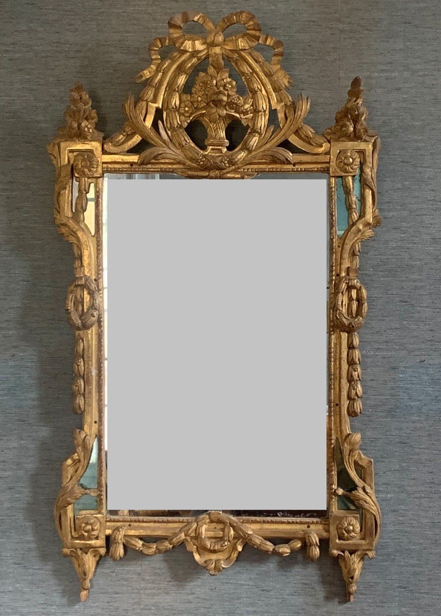 Louis XVI Period Mirror With Parecloses In Carved And Gilded Wood