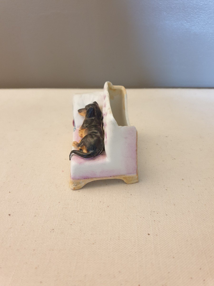 Little Biscuit Dog On A Bench. Porcelain-photo-1