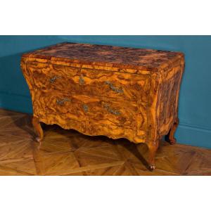 A Walnut Veneered Chest Of Drawers Rounded In Shape 