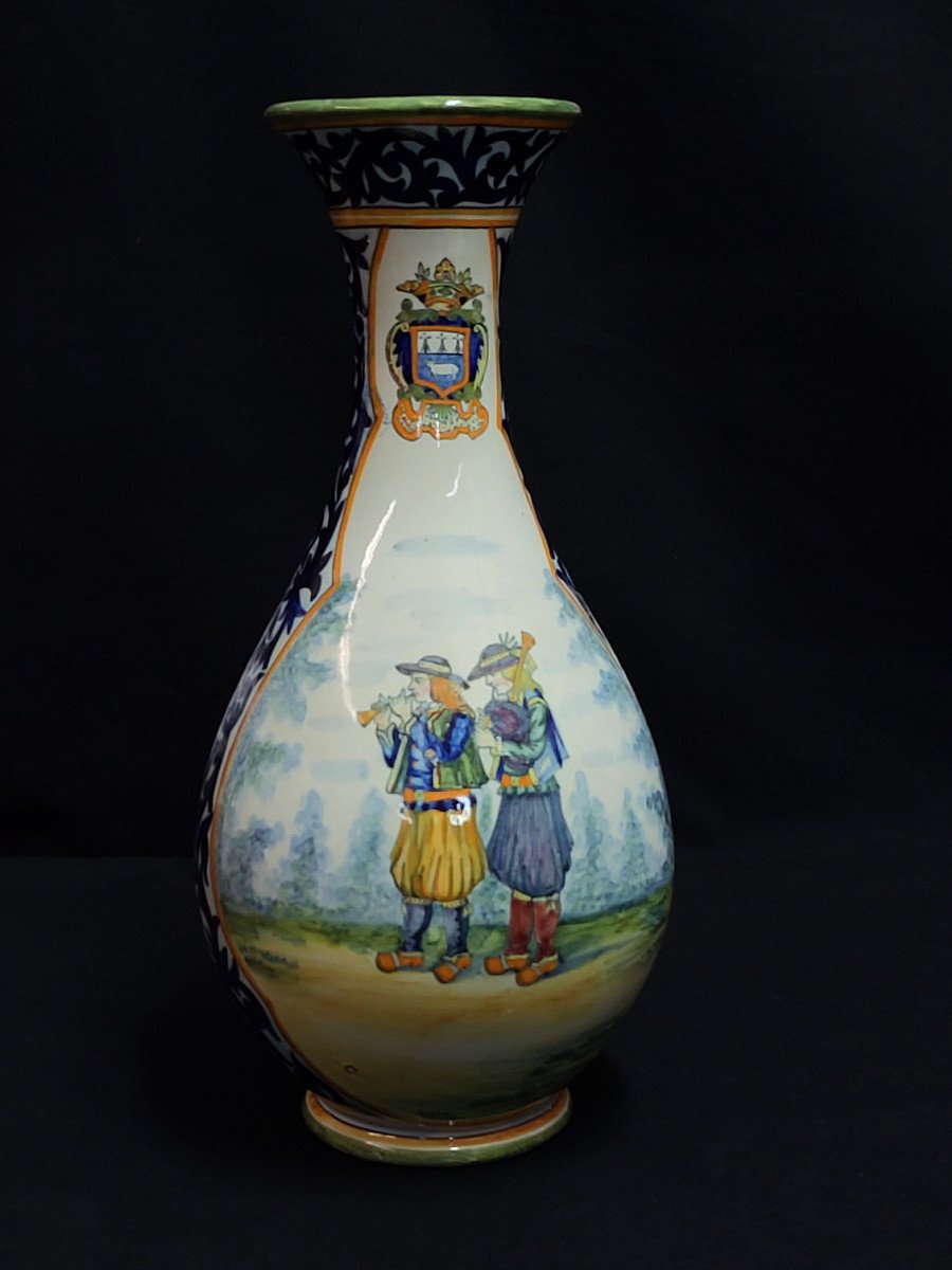 Henriot Quimper, Large Vase Decorated With Bell Ringers And A Bouquet Of Flowers.