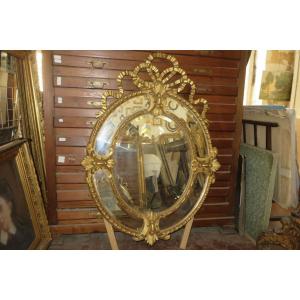 Large Oval Mirror, With Pediment, In Golden Wood, 19th Time.
