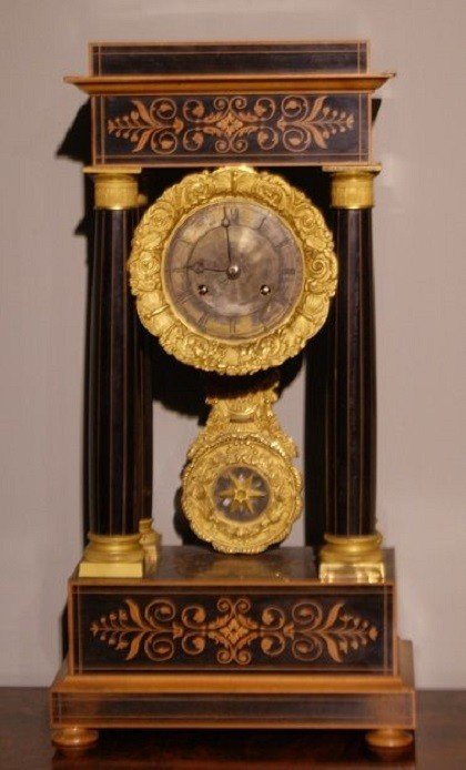 French Clock From The Mid-1800s, Charles X Style, In Boxwood And Ebonized Wood. It Features Ric