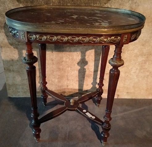 Oval Coffee Table In Mahogany Wood Enriched With Numerous Bronze Applications  