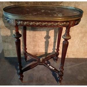 Oval Coffee Table In Mahogany Wood Enriched With Numerous Bronze Applications  