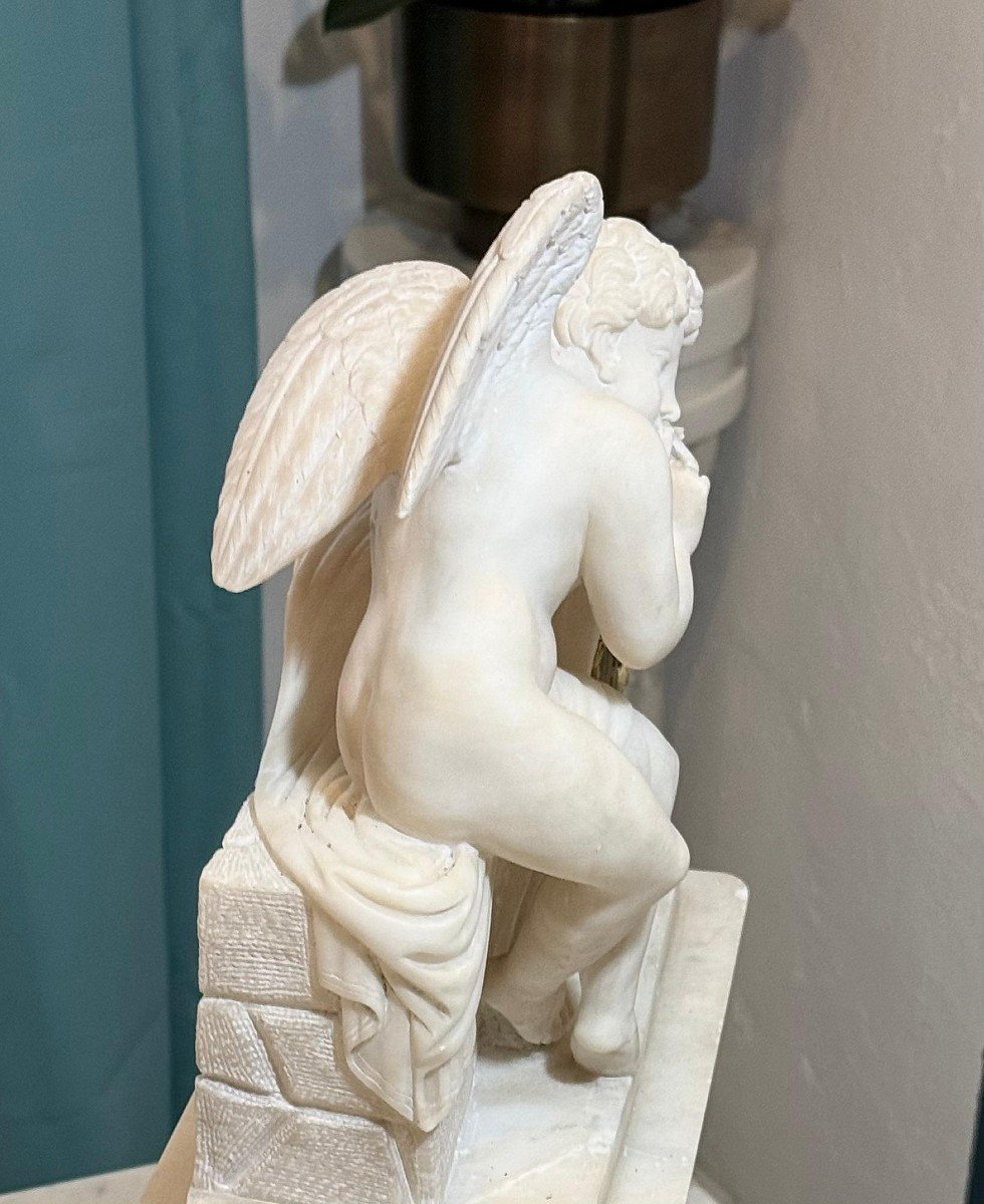 French Clock In Alabaster With Sculpture Depicting A Little Angel-photo-1