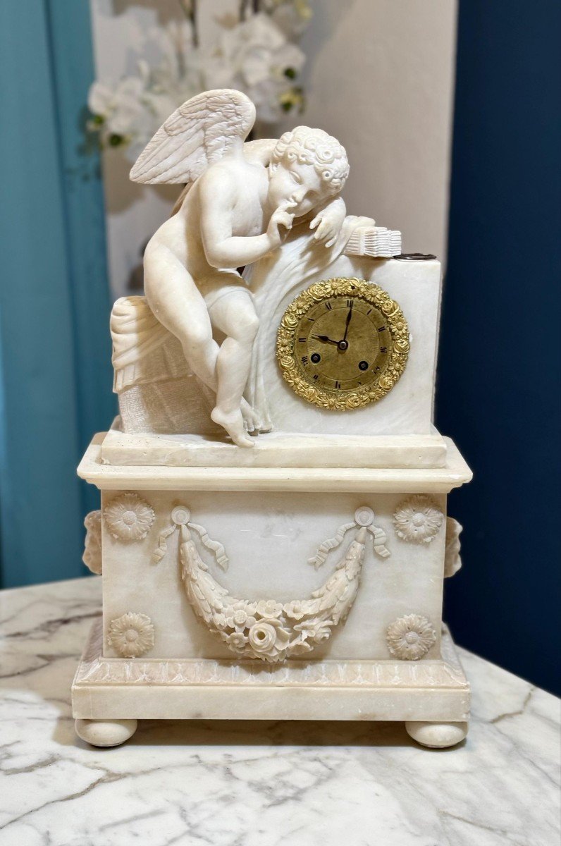 French Clock In Alabaster With Sculpture Depicting A Little Angel