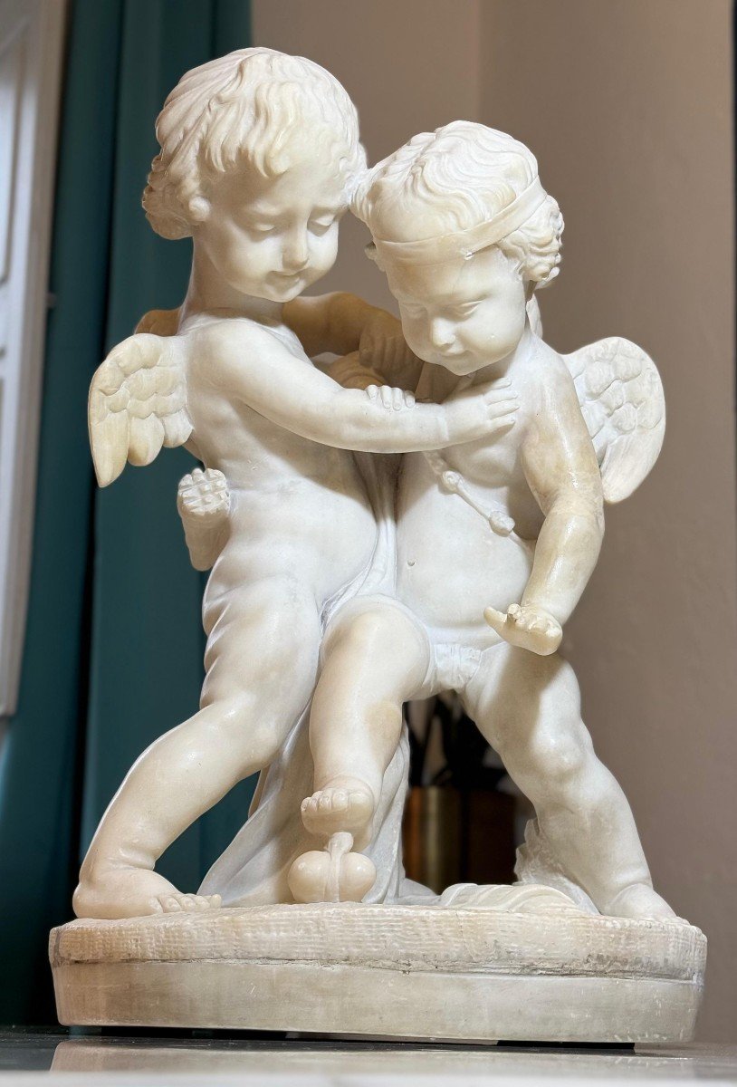 Sculpture Depicting Two Angels Fighting For The Heart Marble-photo-1