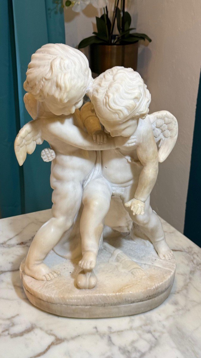 Sculpture Depicting Two Angels Fighting For The Heart Marble-photo-2