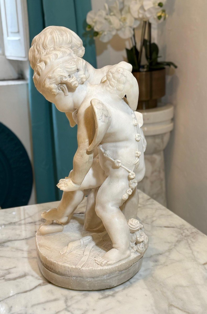 Sculpture Depicting Two Angels Fighting For The Heart Marble-photo-3