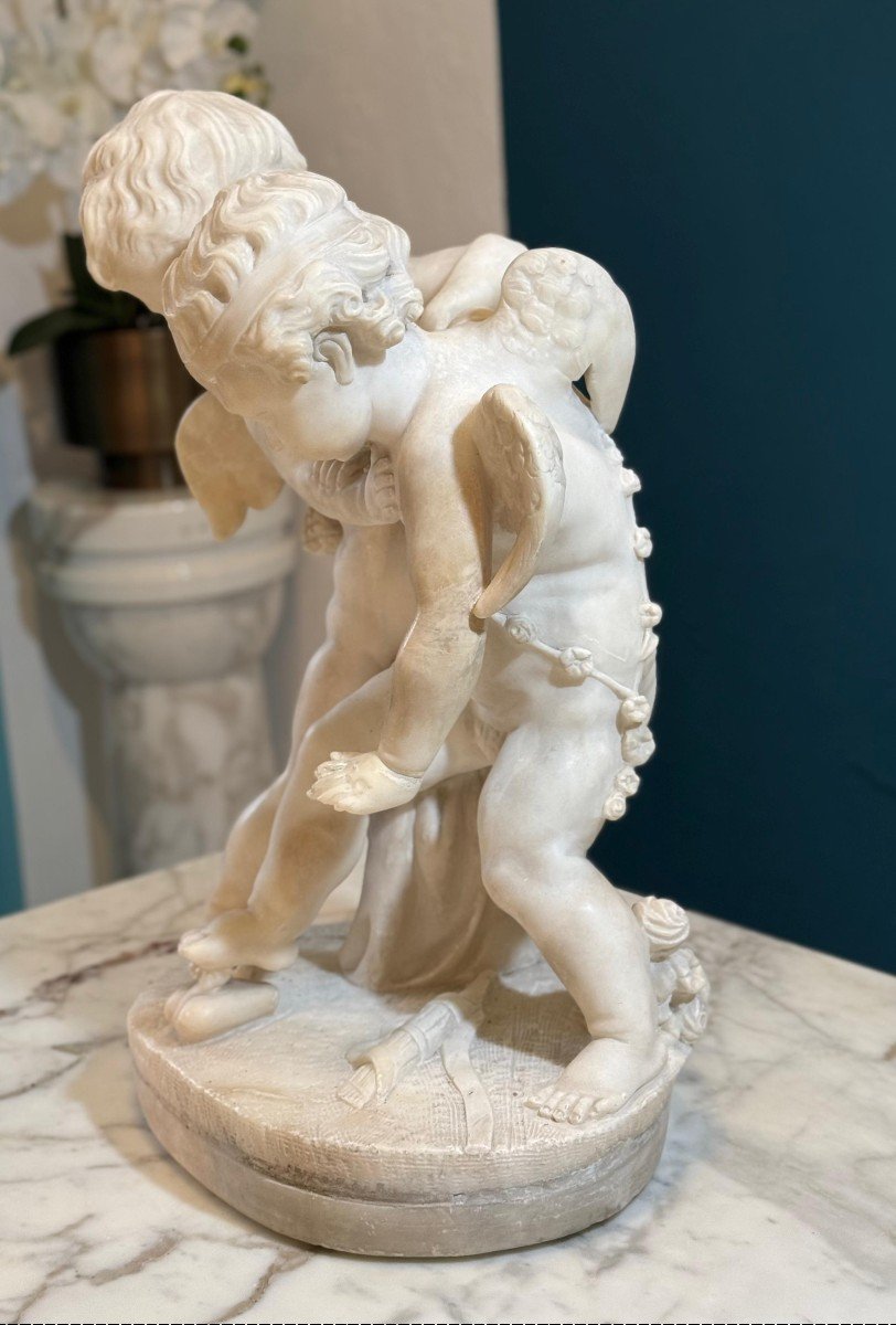 Sculpture Depicting Two Angels Fighting For The Heart Marble-photo-6