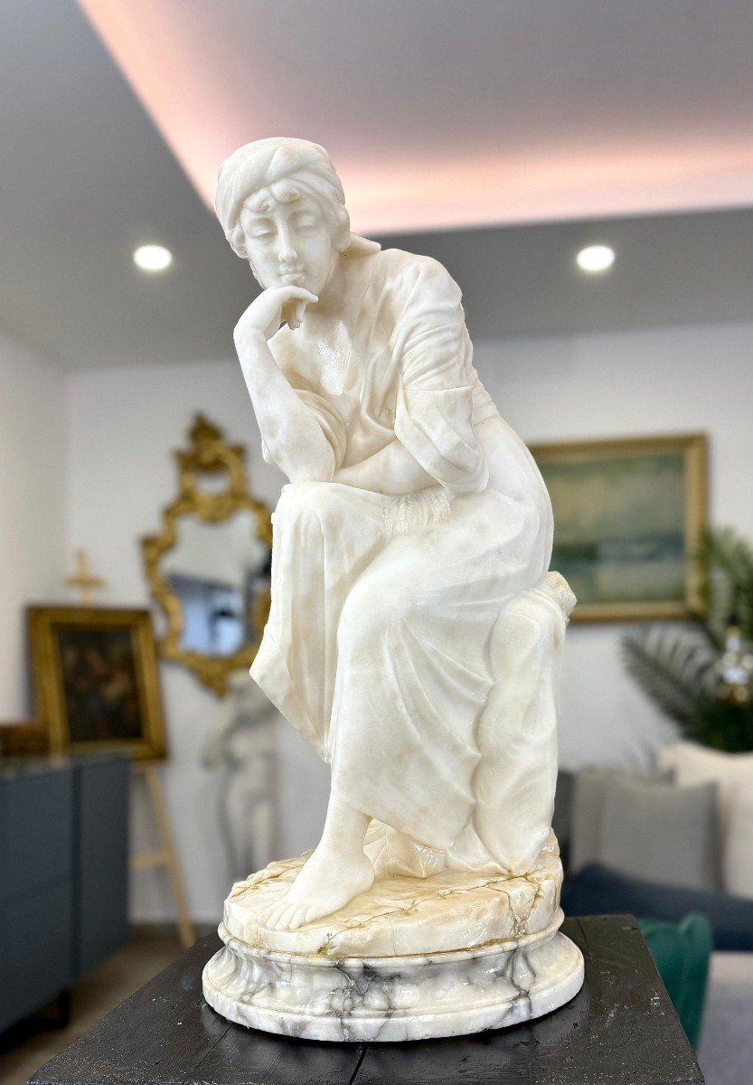 Statue Depicting A Lady Sitting Marble-photo-1