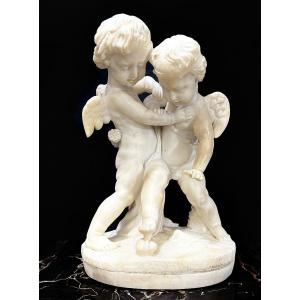 Sculpture Depicting Two Angels Fighting For The Heart Marble