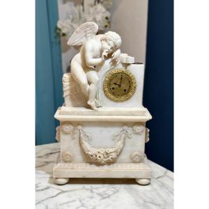 French Clock In Alabaster With Sculpture Depicting A Little Angel