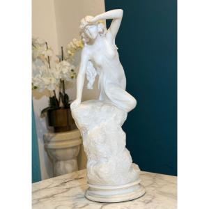 Statue Depicting A Girl Climbing On A Rock In White Statuary Carrara Marble 