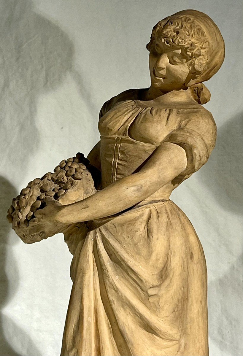 Young Woman With Terracotta Fruit Basket-photo-3