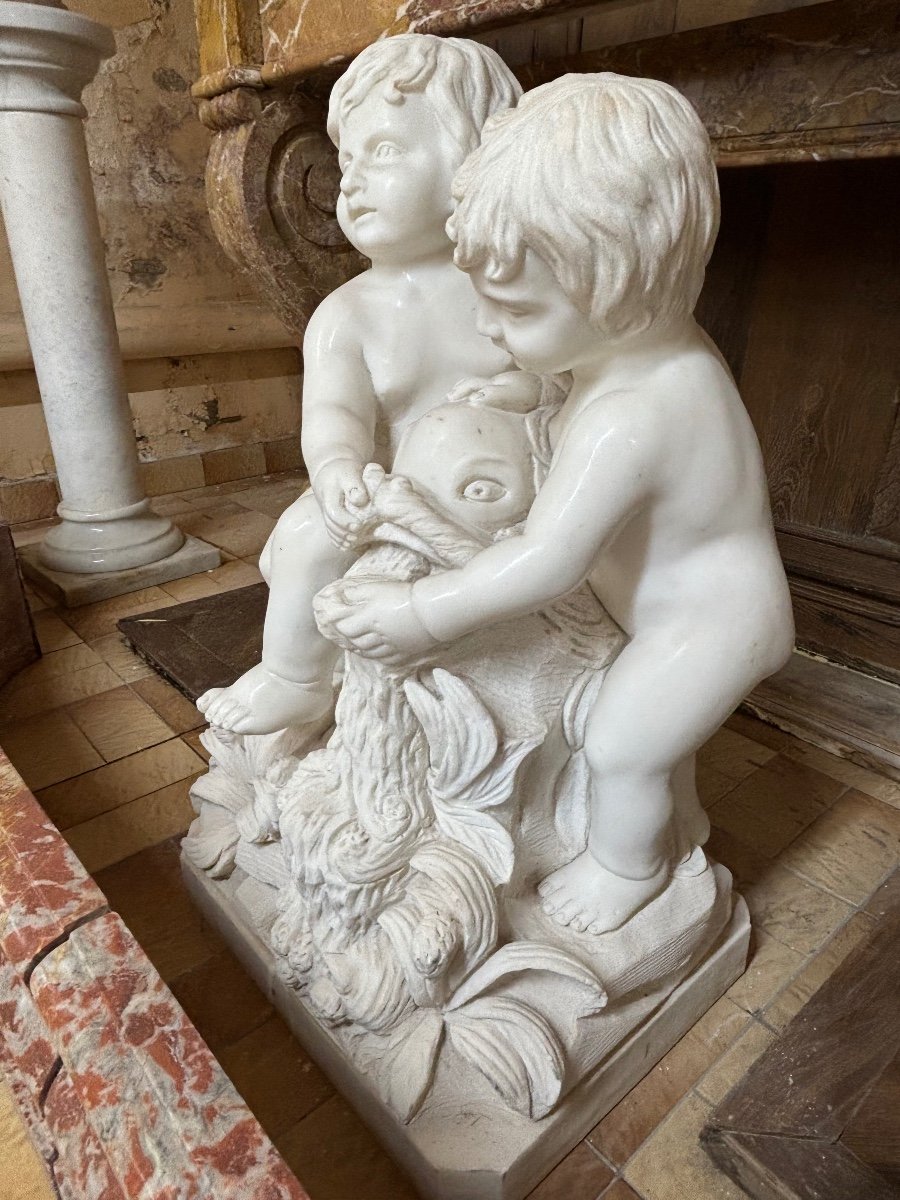 Beautiful White Marble Group Depicting Two Babies Sitting With A Fish -photo-1