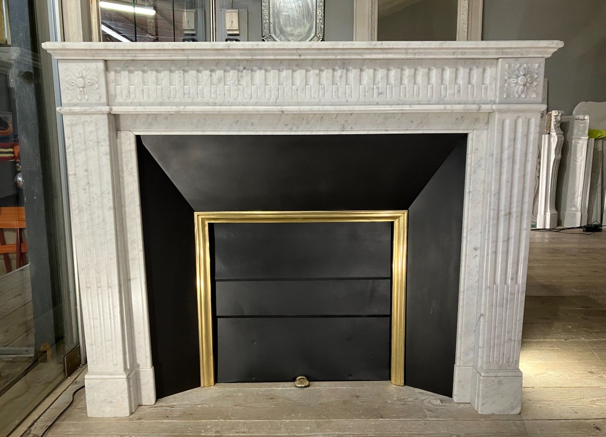 Antique Louis XVI Style Fireplace In White Marble.