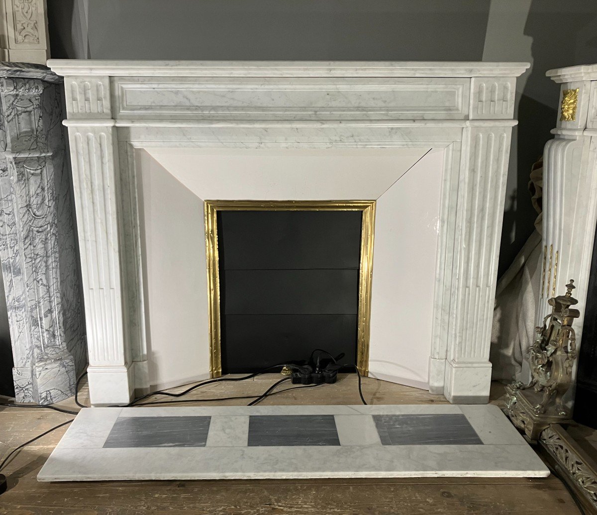 Antique Louis XVI Style Fireplace In White Marble.