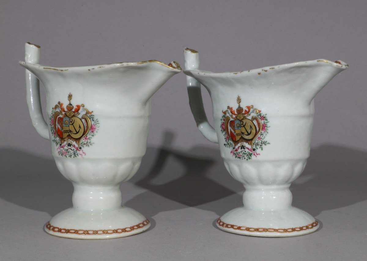 A Pair Of 18th Century Dutch Qianlong Market Armorial Helmet Cream Pitchers