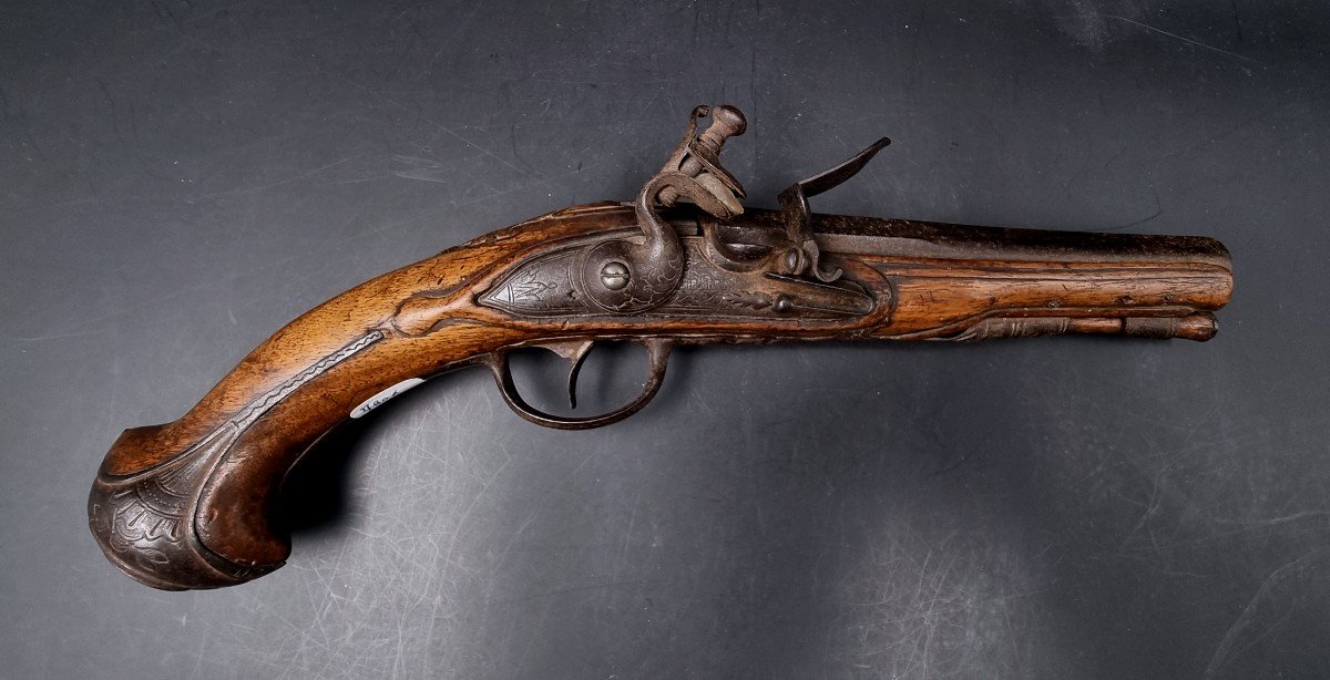 Carved Walnut Flintlock Pistol, Paris Marked Plate, Gilded Barrel 