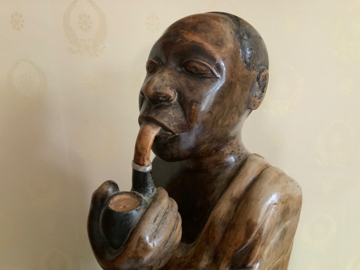 Wooden Statue Of An African Chief Smoking A Pipe-photo-4