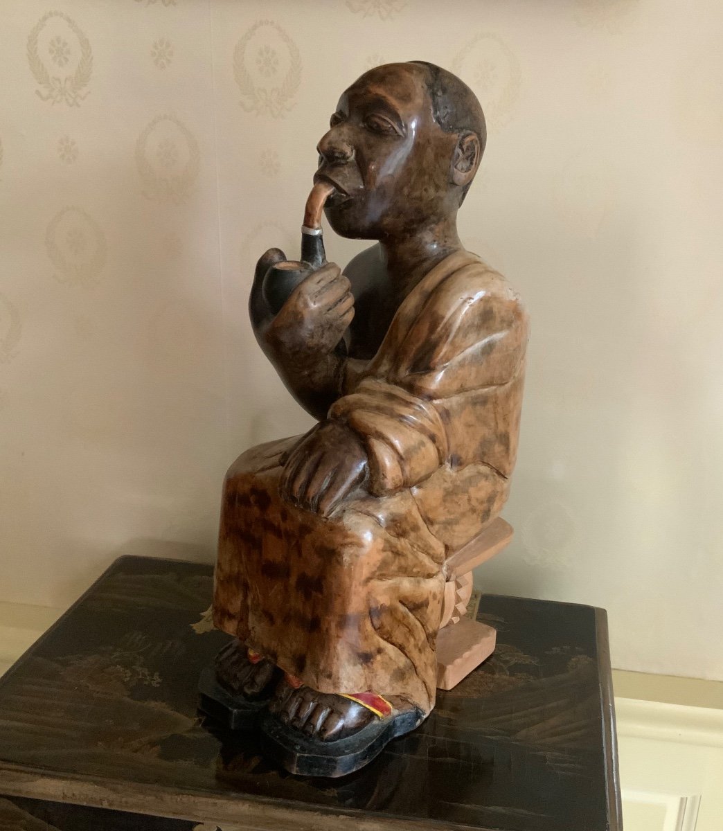 Wooden Statue Of An African Chief Smoking A Pipe-photo-5
