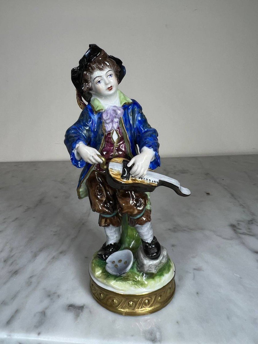 "hurdy-gurdy Player" German Polychrome Porcelain, Late 19th Century