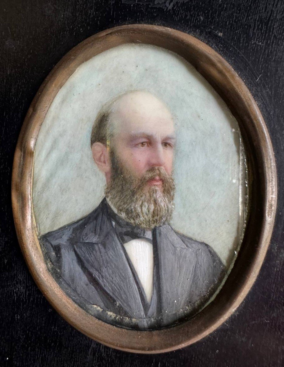 Oval Shaped Painted Miniature Portrait Representing A Bearded Man In A Black Jacket.