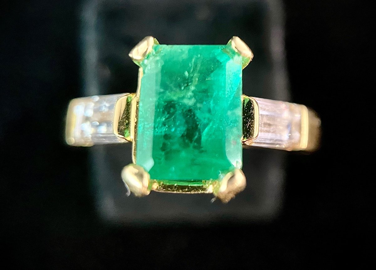 Yellow Gold Ring Set With A 1.25 Carat Emerald And Two Baguette Cut Diamonds 0.70 Ct