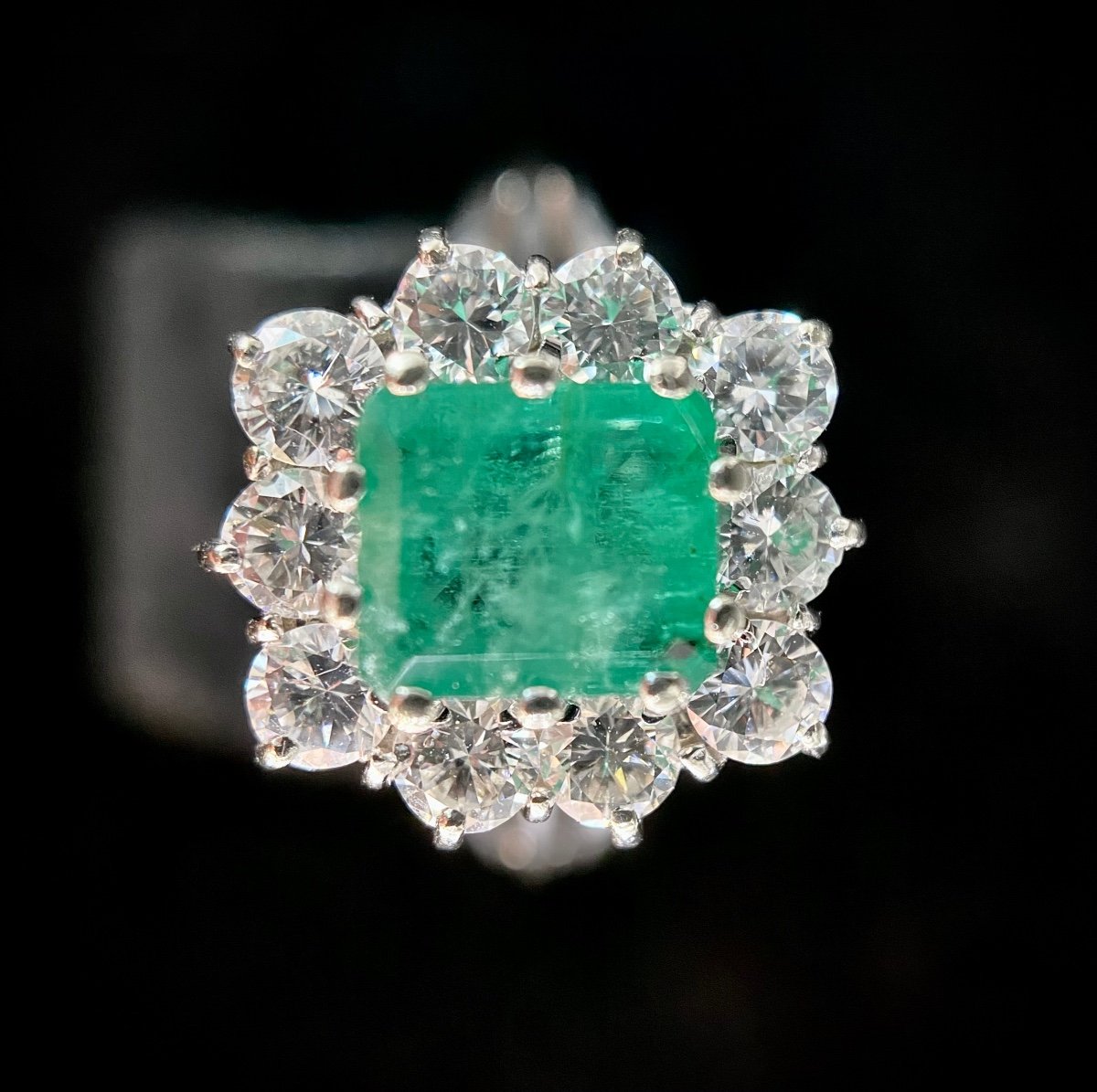 White Gold Ring Set With A 1.10 Carat Emerald Surrounded By 1.30 Carats Of Brilliants