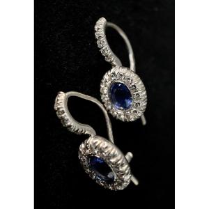 Pair Of 18k White Gold Earrings Set With 2 Oval Sapphires Total: 1 Carat