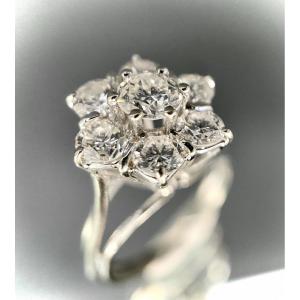 Marguerite Model Ring In White Gold With A Central Diamond Of 0.30 (si-e/f) And A Surround Of 1.20 Carats