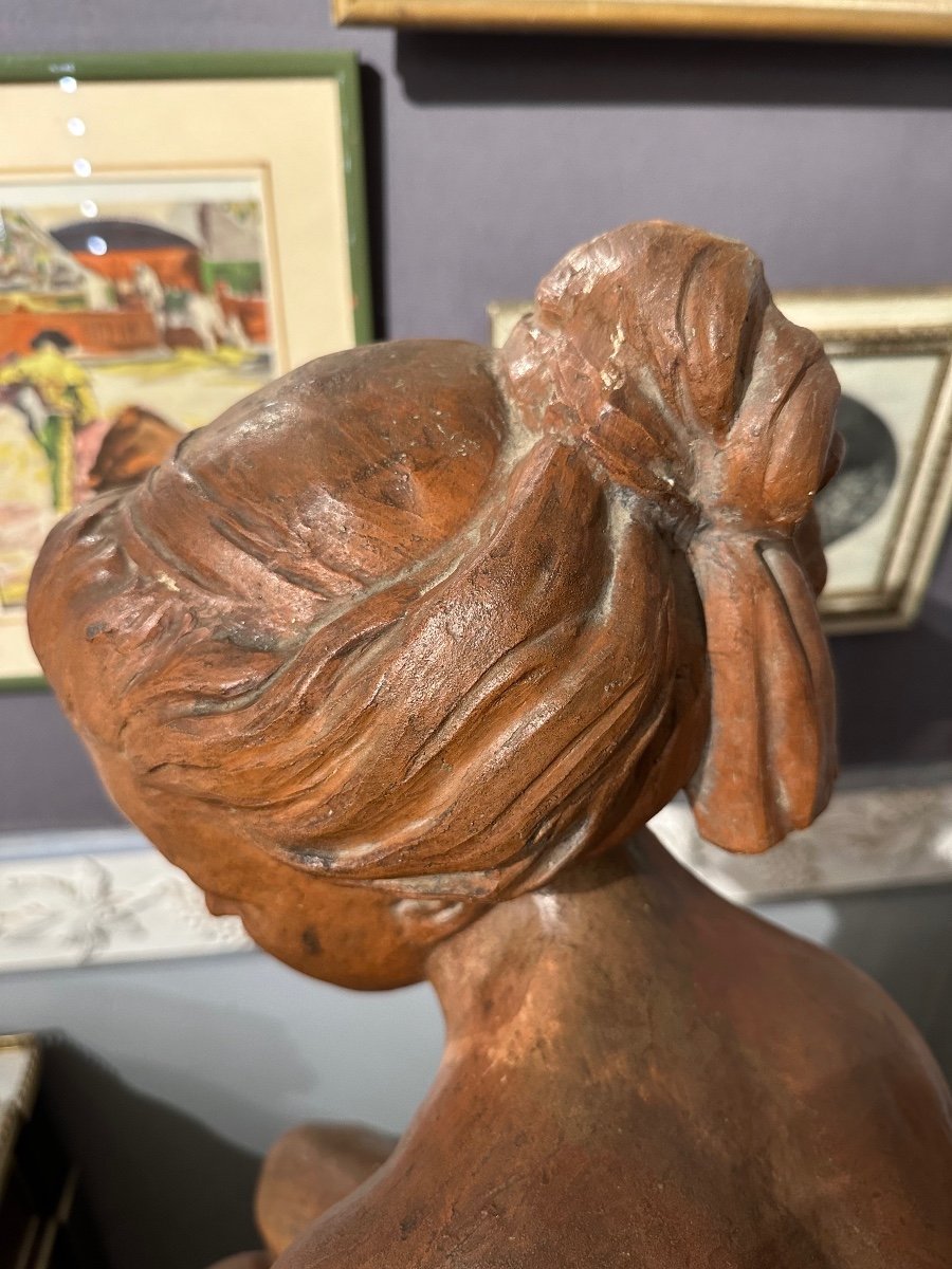 Young Girl Sitting On A Rock Holding A Bow In Terracotta 18th Century -photo-1