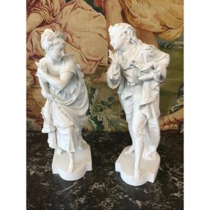 Two Large Biscuit Porcelain Characters