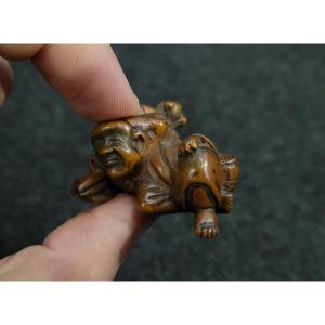 Netsuke - Lying Monkey Trainer - Wood