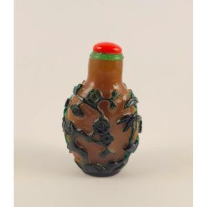 Green Overlay Glass Snuff Bottle On Caramel Background