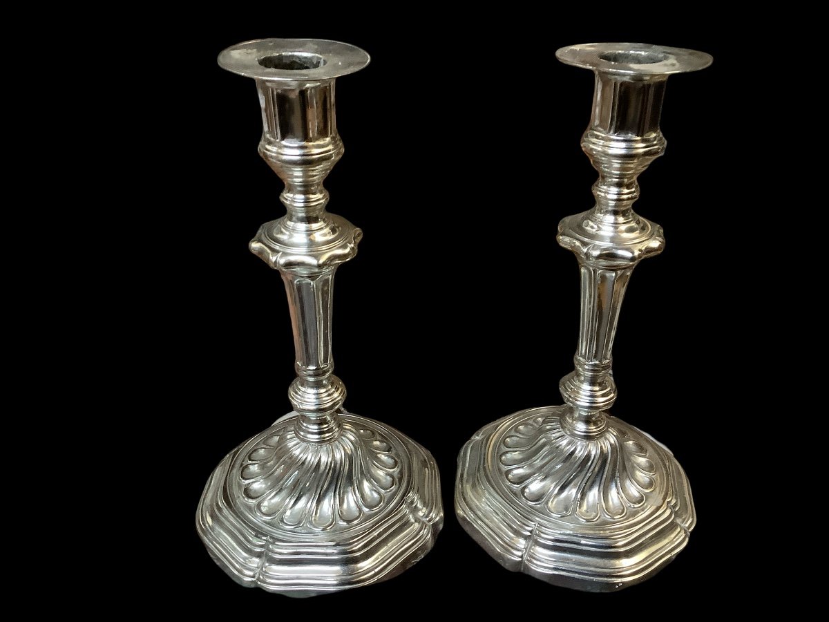 A Pair Of Silver Bronze Candlesticks