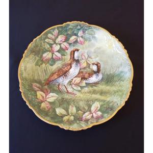 Plat peint à décor de perdrix en porcelaine datant du début du  XX°