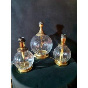 Series Of Three Hollywood Regency Glass And Brass Lamps.