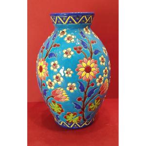 Kéramis - Vase Decorated With Flowering Stems And Small Flower Seedlings On A Light Blue Background.