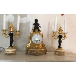  Pendule  d’epoque Napoleon IIIet sa paire de flambeaux