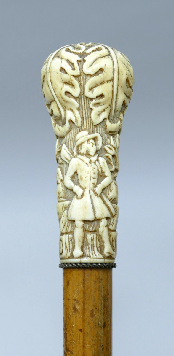 Cane With Ivory Handle Representing A Hunter And His Dogs Dated To The 19th Century