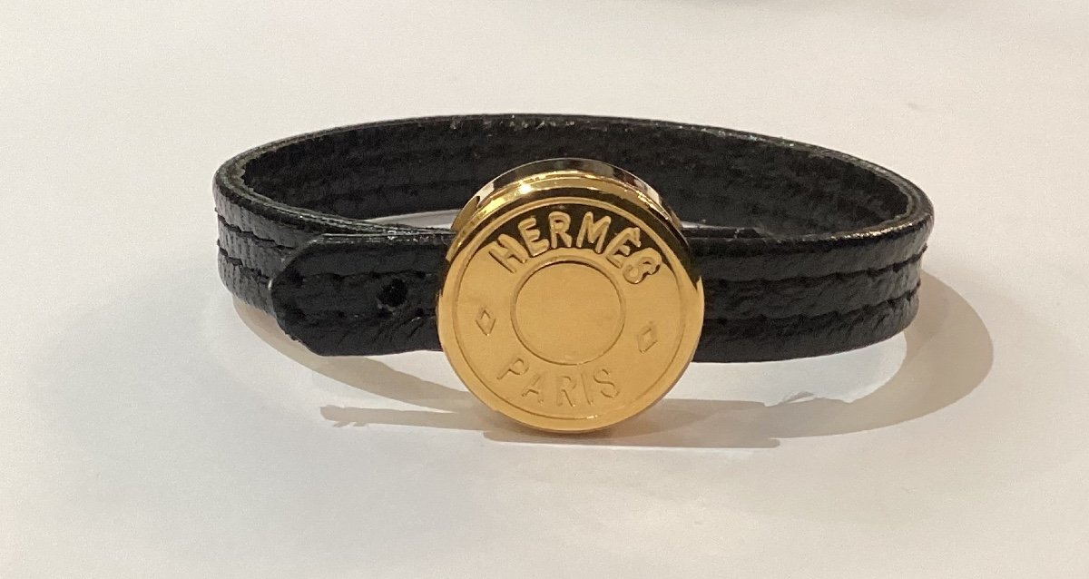 Hermès - Bracelet In Gold Metal And Black Leather  