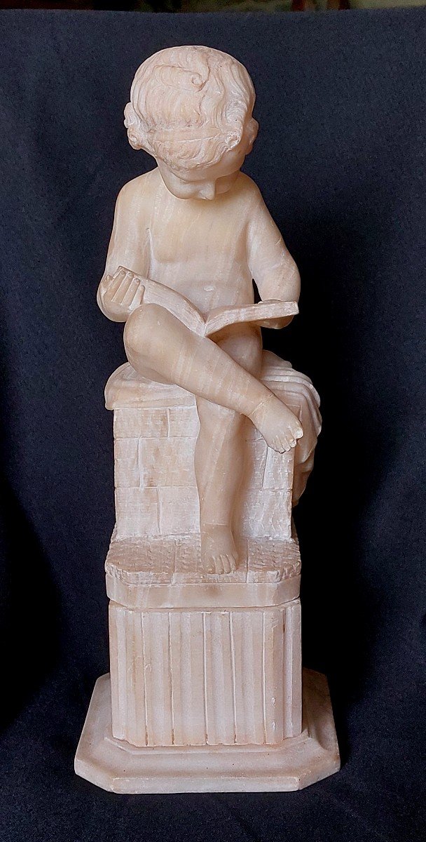 Statue. Child Reading In Alabaster.