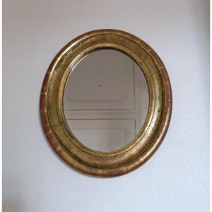 Small Oval Mirror In Gilded Wood, Late 20th Century.