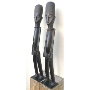 Pair Of Bateba Hardwood Statues With Black Patina. Lobi, Burkina Faso. Mid-20th Century.